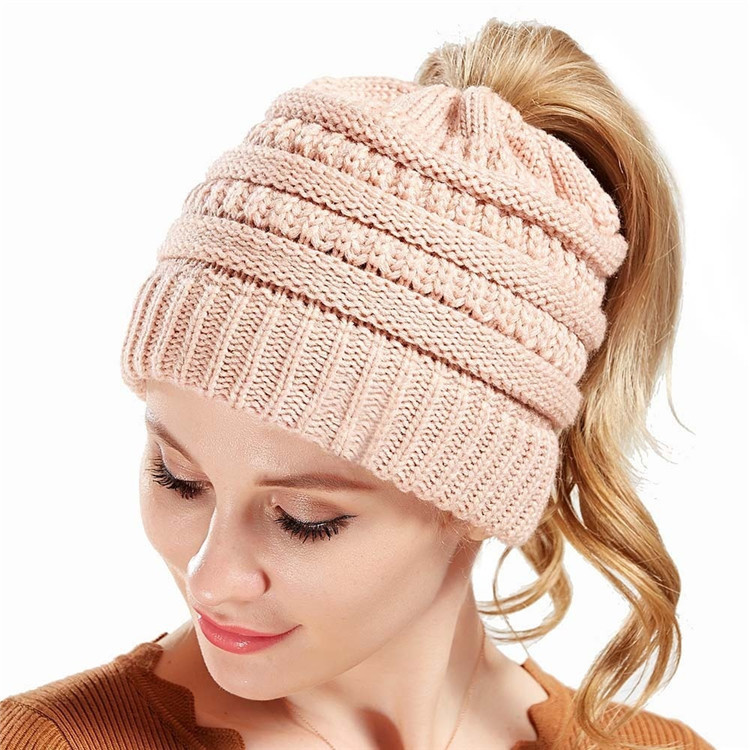 Quality Round Brim Ponytail Beanie Hat For Women Winter Warm Soft Stretch Cable Knit Messy High Bun Hat wholesale