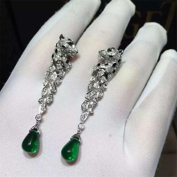 C Cheetah Earrings - showing the charm of courage, naughty or docile .310 round bright cut diamonds, emerald and onyx.