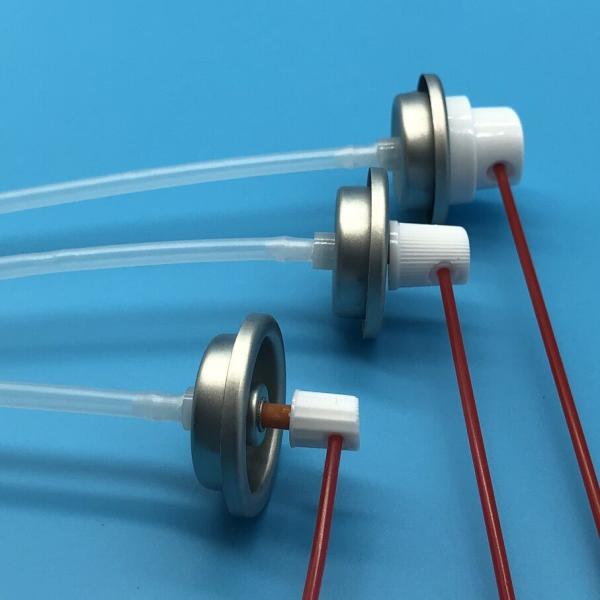 Close-up of carburetor cleaner spray valve showing metal construction