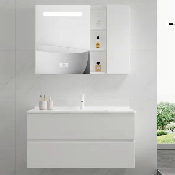 Modern wall-mounted bathroom vanity with marble countertop and integrated sink