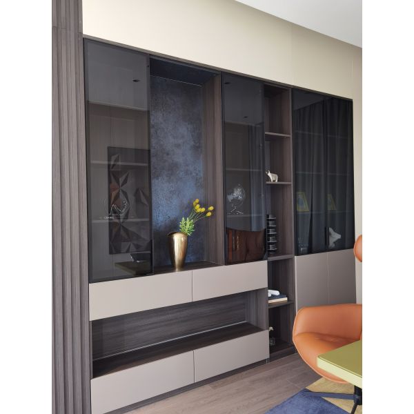 Display cabinet with integrated storage compartments